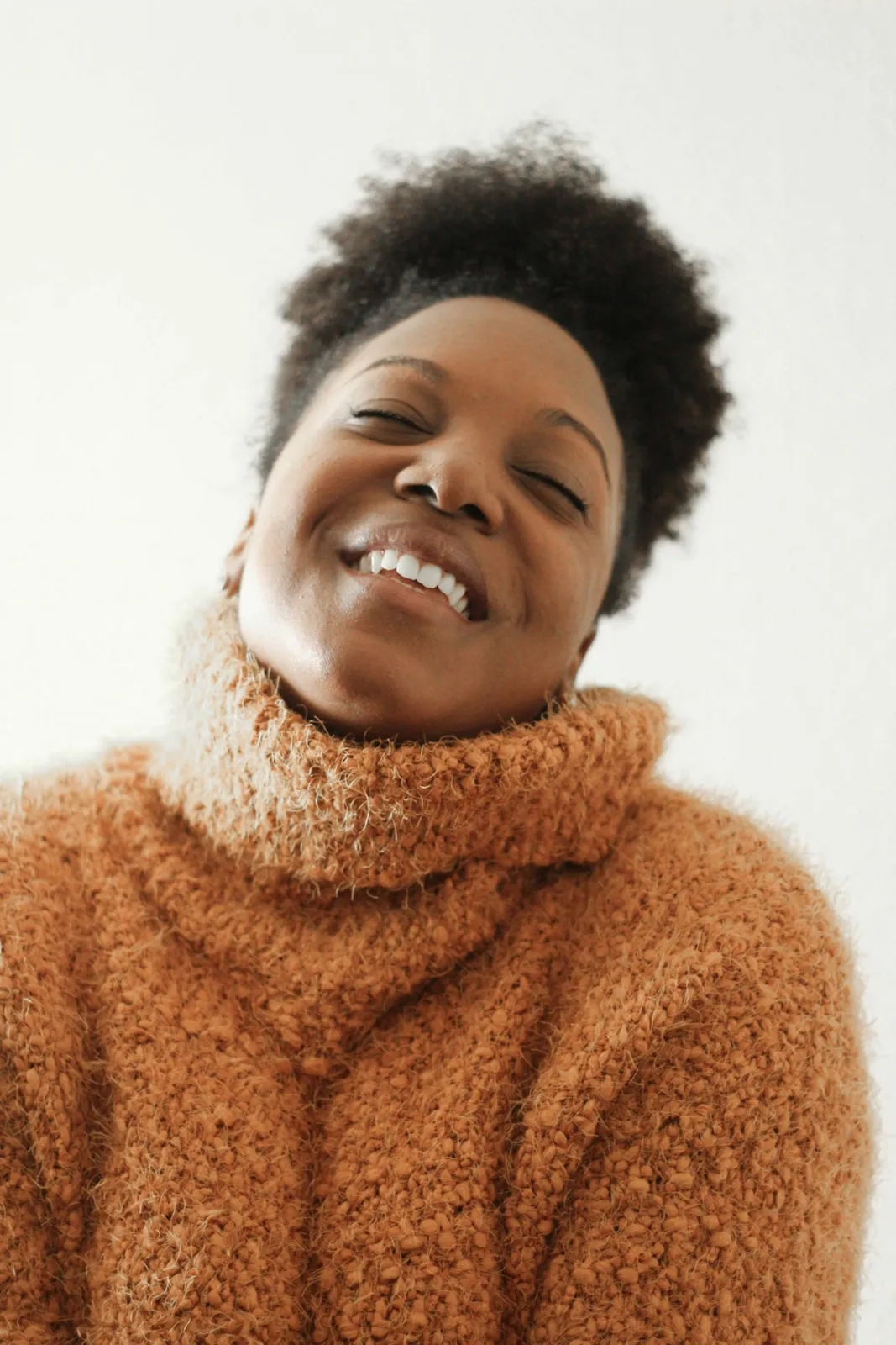 Smiling woman in a knitted sweater
